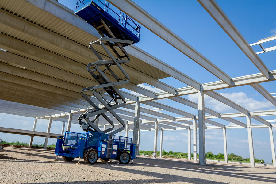 Scissor lift on a TQC Rental site